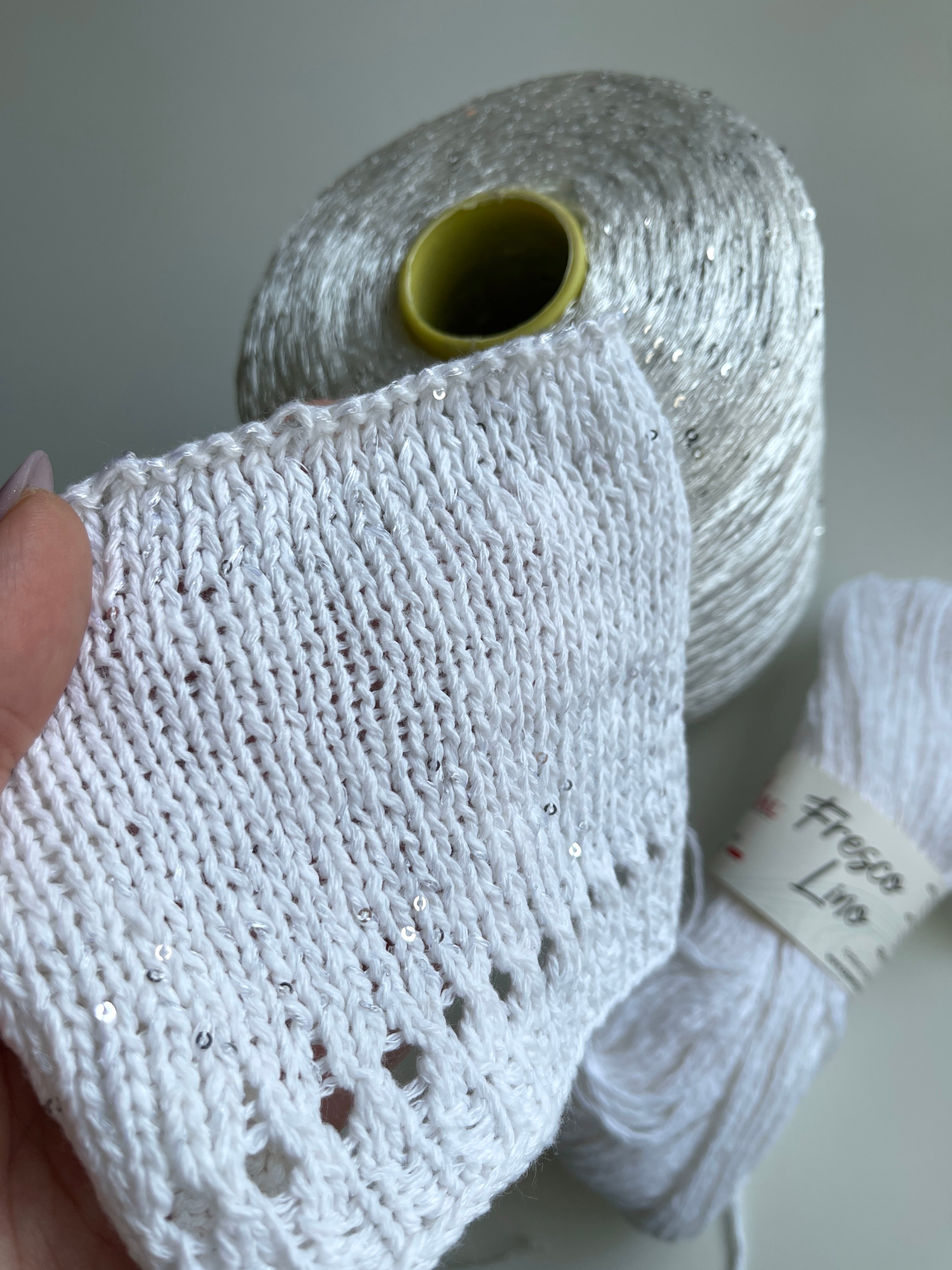 Sequins from Cofil on a cone (silver on white)