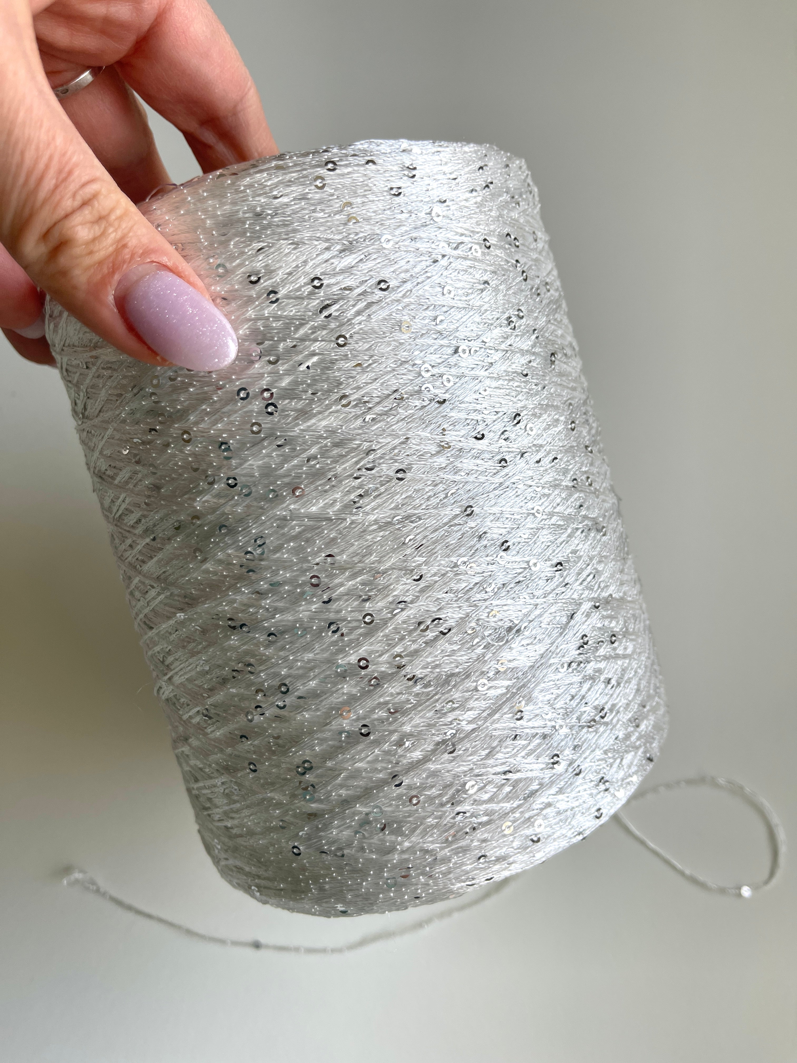 Sequins from Cofil on a cone (silver on white)